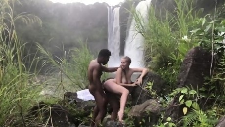 Beautiful White Chick Gets Blacked By Waterfall